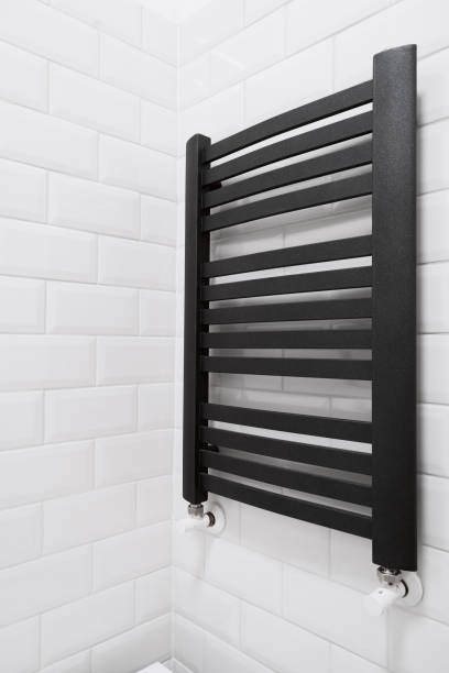 istock black metal heated towel rail in bathroom 1463044103