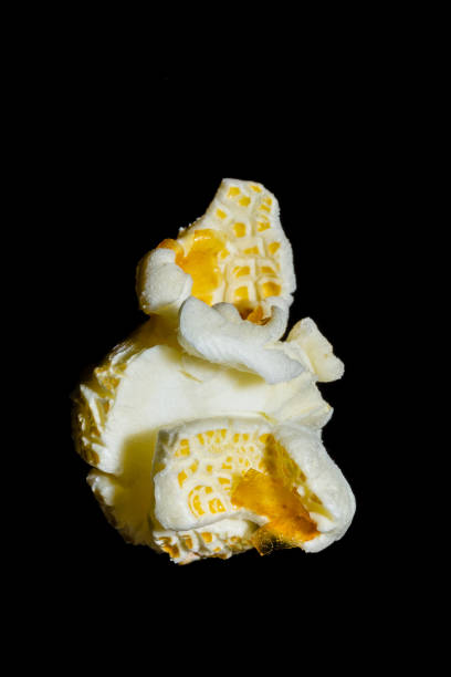 macro photography of popcorn on a black background