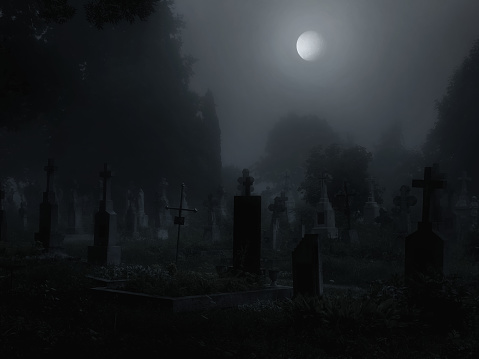 Moon over a dark mysterious cemetery. Crosses and graves at night in the moonlight.