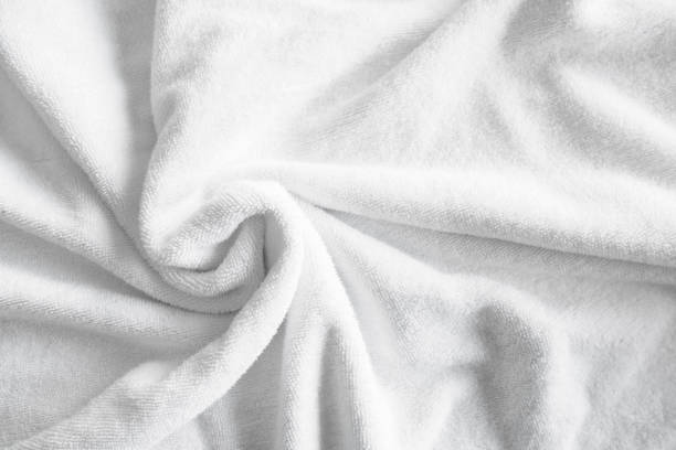 istock The Textured white natural cotton towel background photo with selective focus. 1463052277