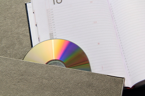 a folder with DVD in a blank notepad