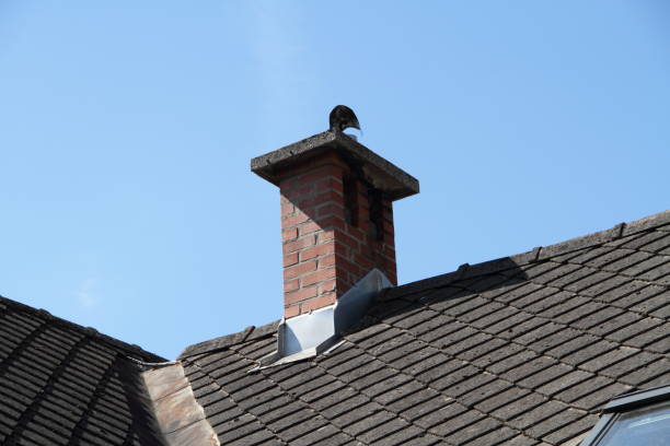 istock a house roof with a chimney 1463053105