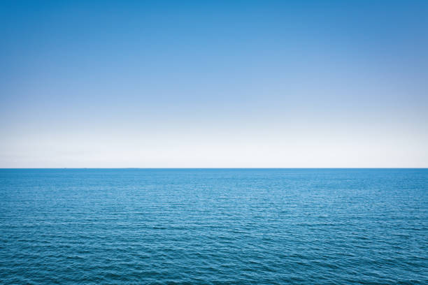 istock Horizon line, blue sky and blue sea. Drone view 1463054117