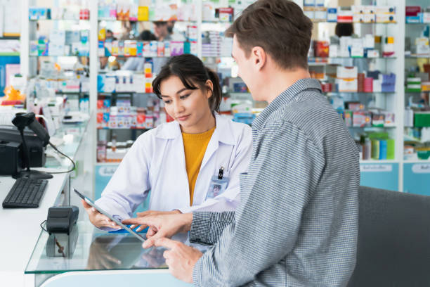 istock Caucasian customer purchases qualified prescription medication from pharmacist. 1463054605