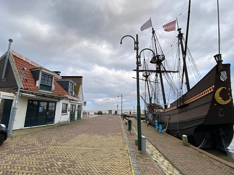 Volendam, Netherlands - January 06, 2023. View of the historical bay of the harbor in the city of  Volendam on a cold day in January