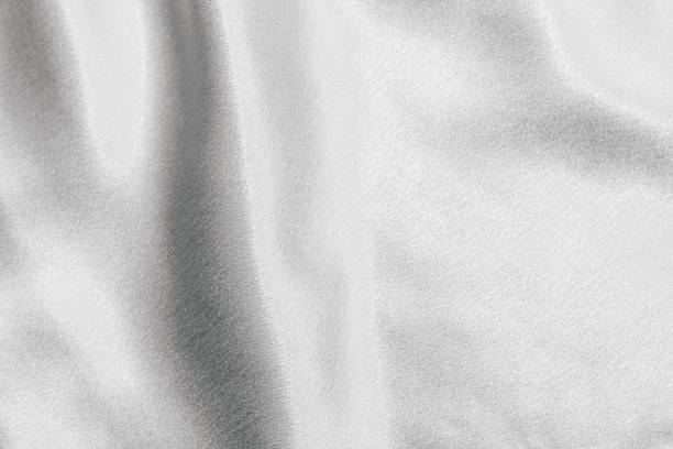istock White silk fabric texture, Satin fashion Background for content. 1463061155