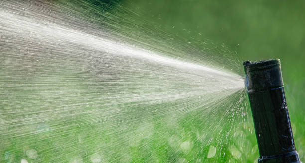 istock automatic sprinkler system watering the lawn close up 1463063317