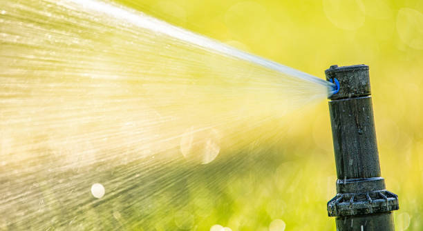 istock automatic sprinkler system watering the lawn close up 1463063332