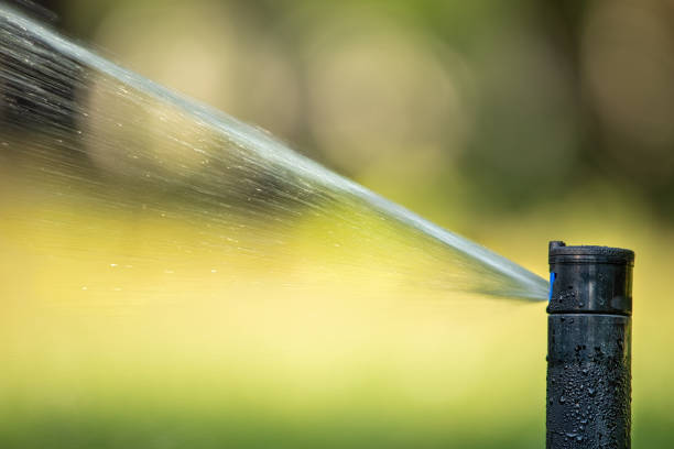 istock automatic sprinkler system watering the lawn close up 1463063349
