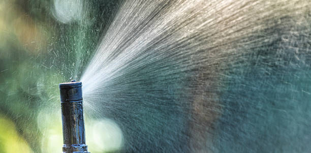 istock automatic sprinkler system watering the lawn close up 1463063354