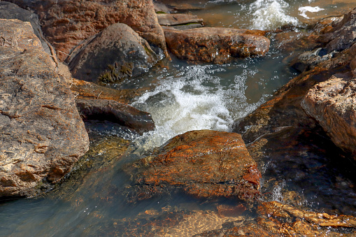 Water flows between the rocks in this shot of the South Fork River (Comer, Georgia).