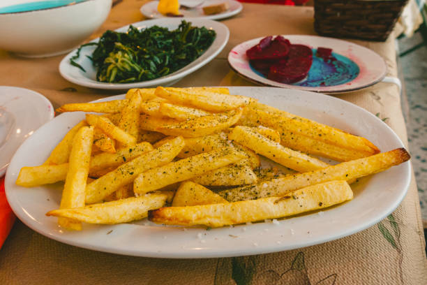 French fries , rucola salad and beetroot salad