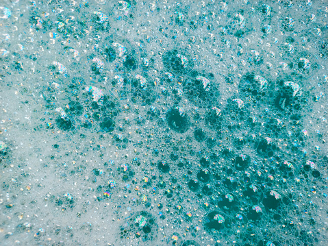 Summer blue color soap bubble abstract or pure natural foam texture background.