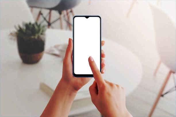 istock Female hand using blank touchscreen of smart phone. Isolated display in white for app design presentation 1463065336