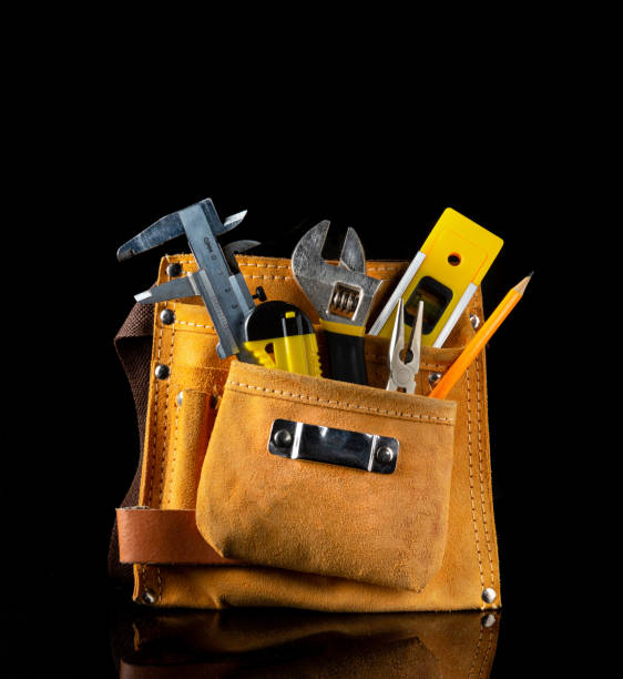 istock Tool kit in suede bag for plumber or construction craftsman on black isolated background 1463065359