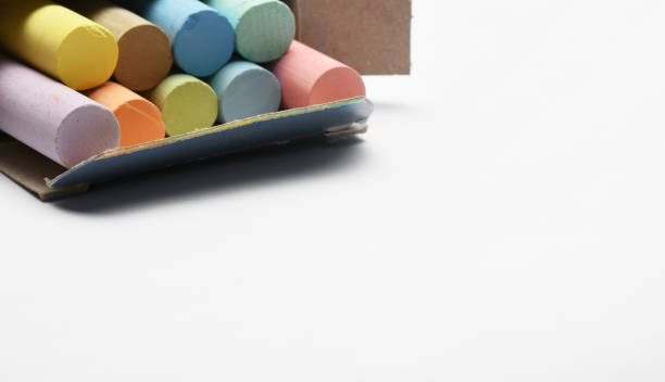 istock Open box of colorful chalks on the white background 1463067252