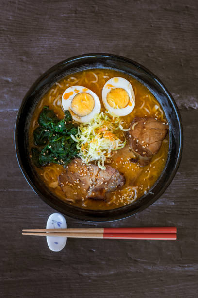 istock Ramen soup bowl and chopsticks on a dark background 1463070576