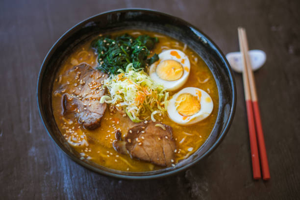 istock Ramen soup bowl and chopsticks on a dark background 1463070580