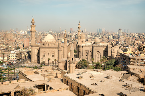 Beautiful daytime view of Masjid Al Nabawi, Medina's green dome, minarets and mosque courtyard.