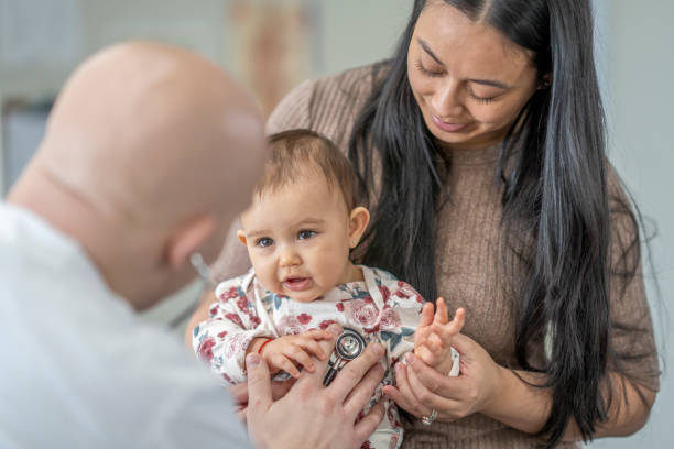 istock Mom and Baby at a Check-Up 1463086165