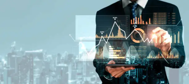 Businessman analyst working with digital finance business data graph showing technology of investment strategy for perceptive financial business decision. Digital economic analysis technology concept.