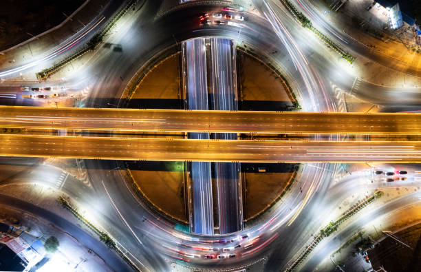 istock Expressway top view, Road traffic an important infrastructure, Drone aerial view fly in circle, traffic transportation, Public transport or commuter city life concept of economic and energ, transport. 1463088672