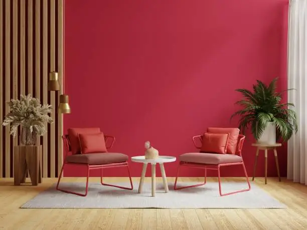Photo of Viva magenta wall background mockup with two armchair furniture and decor accessories.