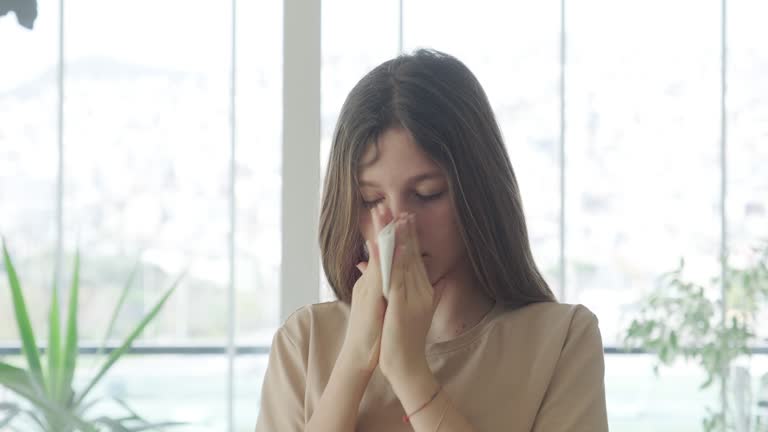 Beautiful young girl with a cold