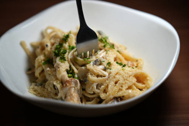 istock Spaghetti Wrapped On A Fork, Creamy Mushroom Fettuccine Alfredo 1463097297