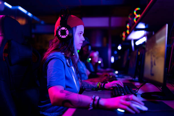 istock Focused female gamer playing massively multiplayer online game on PC. 1463098247