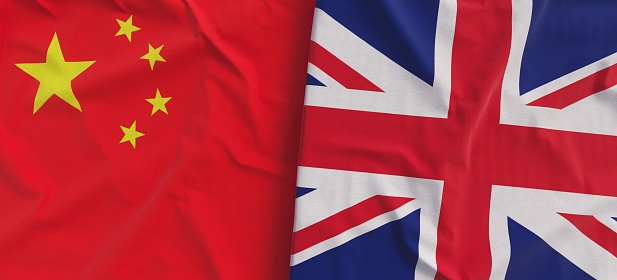 Flags of China and Great Britain. Linen flags close-up. Flag made of canvas. Chinese flag. Beijing. UK. United Kingdom. State national symbols. 3d illustration.