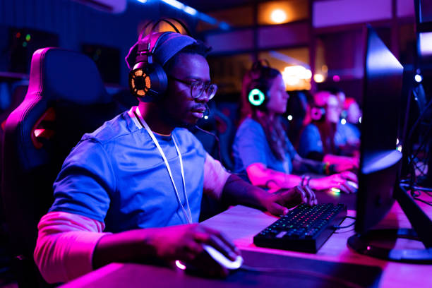 istock Concentrated black gamer playing multiplayer online game on PC. 1463098384