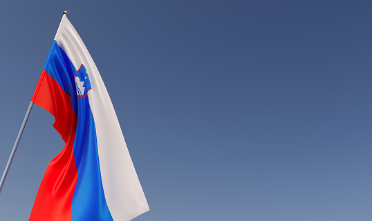 Slovenia flag on flagpole on blue background. Place for text. The flag is unfurling in the wind. Slovenian, Ljubljana. Balkans. 3D illustration.