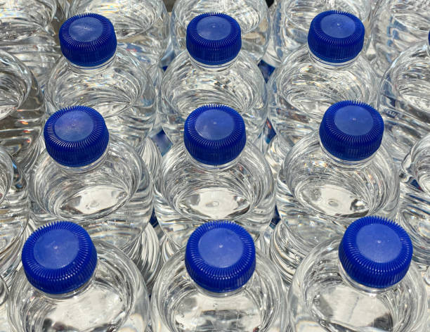 istock Transparent water bottles with blue caps 1463103940