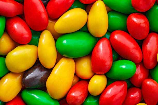 istock Candy glaze in bulk, oval shape, red, green, yellow, close-up, macro, mini pieces, wallpaper background 1463105351