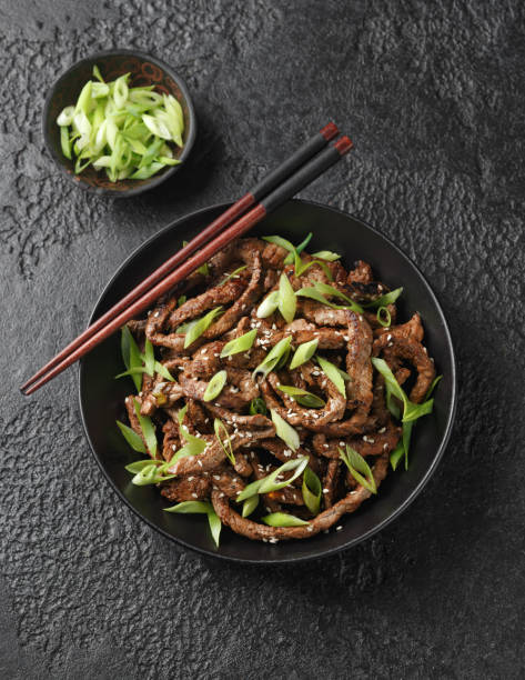 istock Korean beef Bulgogi BBQ with sesame seeds and spring onion. 1463105554