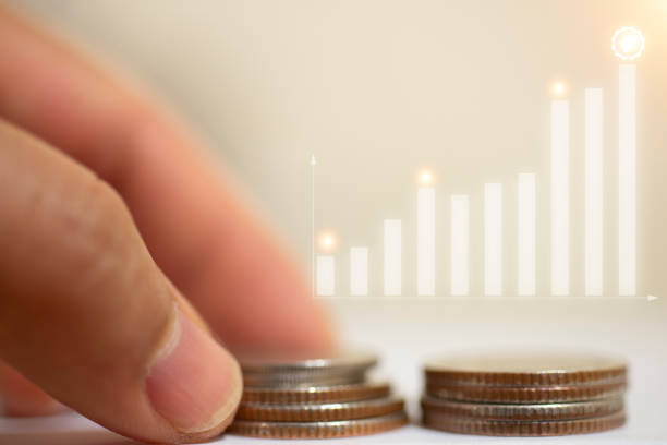 istock stacking coins with a graph of profit. Business successful growth. 1463105770