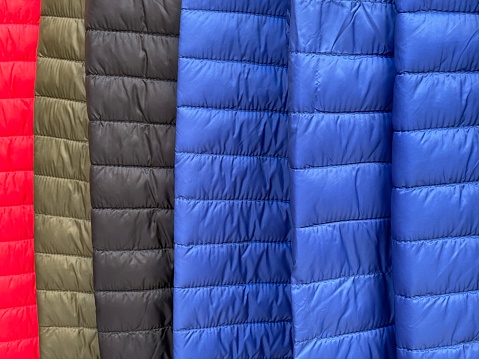Close-up of stitched jackets in a fashion store