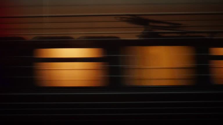 Train passing by a rural station in Russia at night