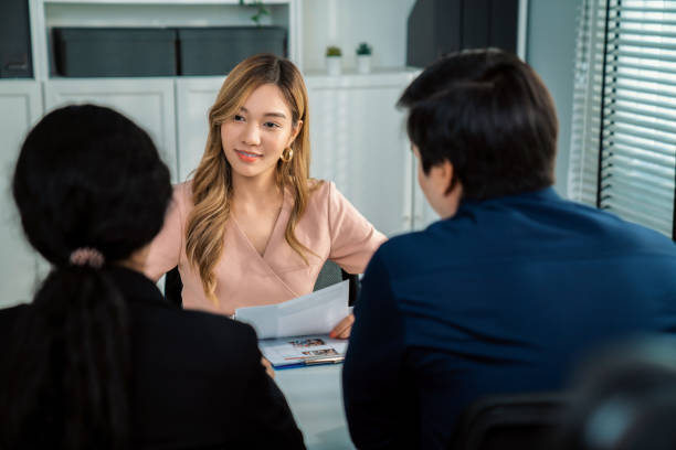 istock Young female asian candidate tries to impress interviewer by being competent. 1463109896
