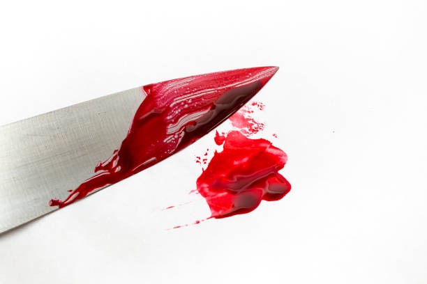 istock Chef knife with red blood smudge on white background 1463112332