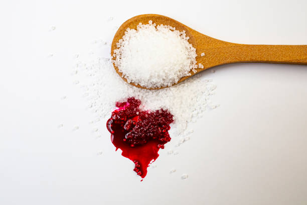 istock Red blood splatter mixed with sugar crystals on white background 1463112355