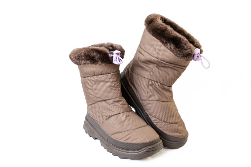 child winter boots, brown colored, isolated on white background