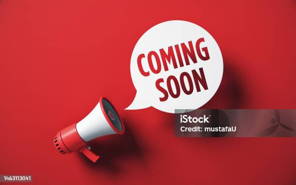 Coming Soon Written Speech Bubble And Red Megaphone On Red Background Stock Photo Stock Photo - Download Image Now