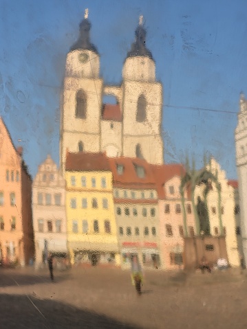 Stadtkirche St. Marien mirrored from the\nGlobe on the Marketplace