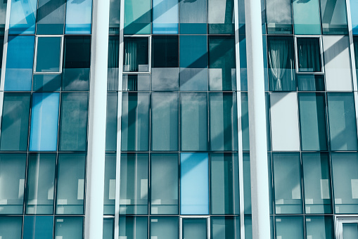 Glass facade of a modern high rise building in vienna close up