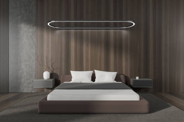 istock Front view on dark bedroom interior with bed, bedsides 1463119485