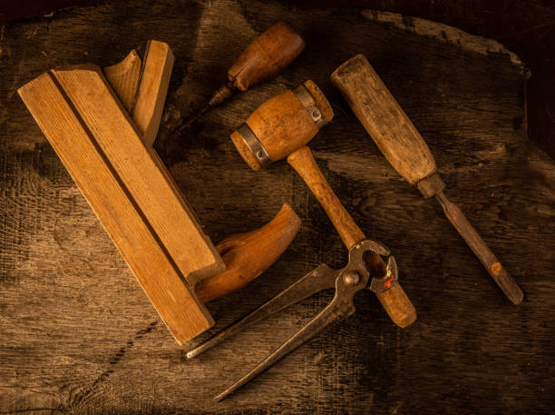 istock Vintage aged carpentry tools on an old wooden board 1463122542