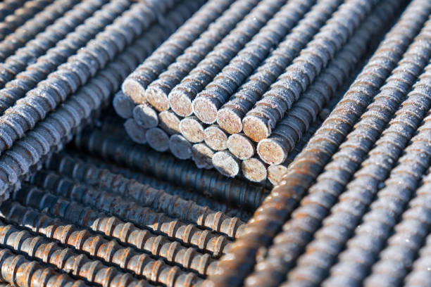 Steel construction rods coated with frost. A set of reinforced steel. metal, iron background. Tied iron rebar close up. Reinforced concrete structure steel bar set. structural steel stock pictures, royalty-free photos & images