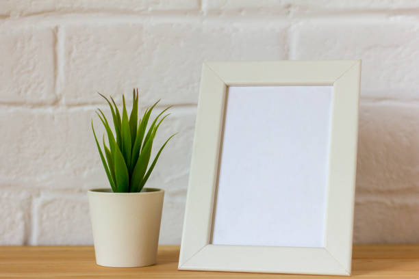 istock An empty photo frame on a table or shelf with a copy of the space 1463124441